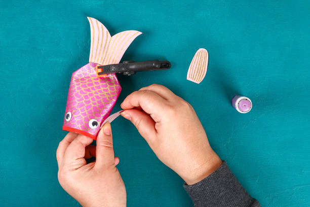 Diy koi carp fish on blue green background.