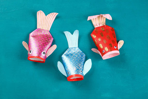 istock Diy koi carp fish on blue green background. 1093610544