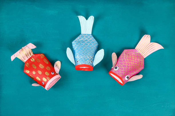 Diy koi carp fish on blue green background.