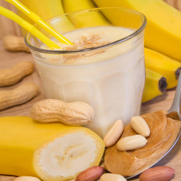 Glass of banana smoothie with peanut butter