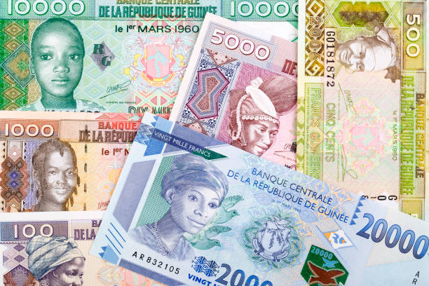 Guinean money a background Guinean money a business background french currency photos stock pictures, royalty-free photos & images