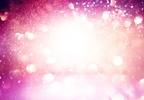Abstract pink gradient background with shiny glowing lights