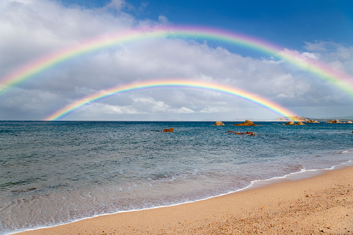 Beautiful double Rainbow after heavy rainstorms at a remote Beach on Sardinia, Italy. Nikon D850. Converted from RAW.