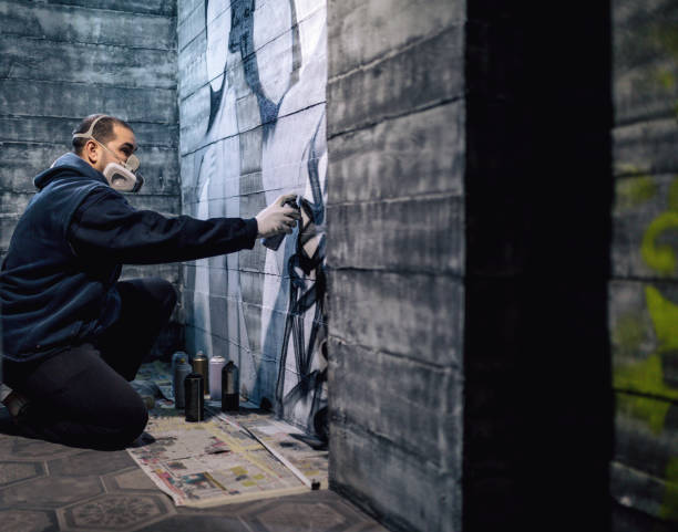 istock Graffiti artist signing his finished piece 1093620520
