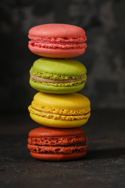 istock macaron or macaroon cake, colorful cookies (dark background). copy space 1093621722