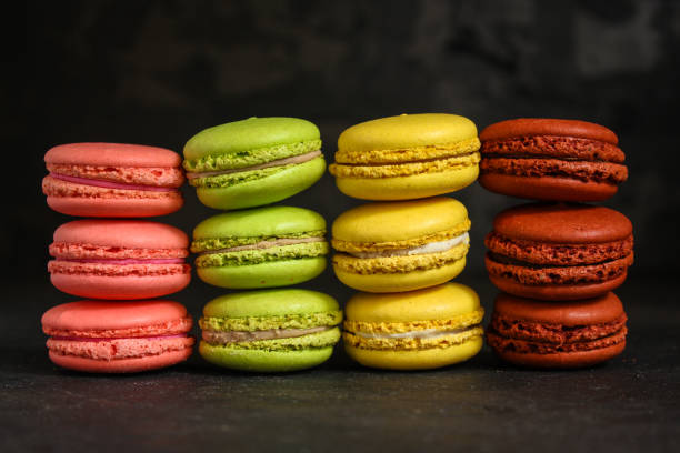 istock macaron or macaroon cake, colorful cookies (dark background). copy space 1093621842