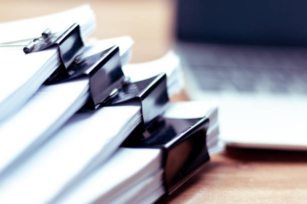 istock Stack of documents placed on a business desk in a business office. 1093622530