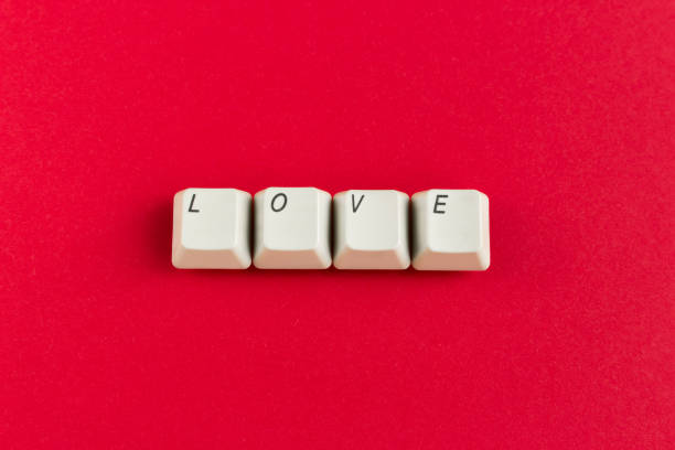 istock Computer keyboard keys with love word written using the white buttons on red background. Valentine's card. Holiday concept. 1093624102