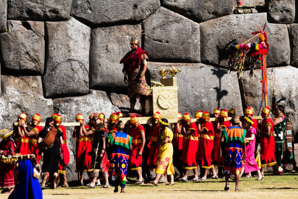 Inti Raymi Ceremony Peru South America Inca Costumes King Cusco, Peru - June 24, 2015: Men and Women Dressed In Traditional Inca Costumes For Inti Raymi Ceremony King Being Carried In"n inti raymi stock pictures, royalty-free photos & images