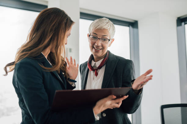 istock Business women revising paperwork 1093627268