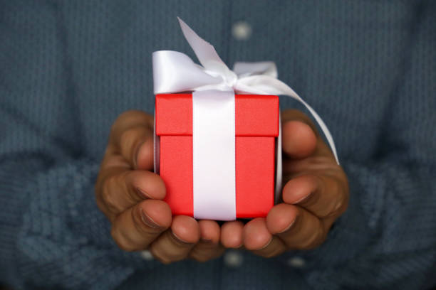istock Gift box in male hands close-up 1093631208