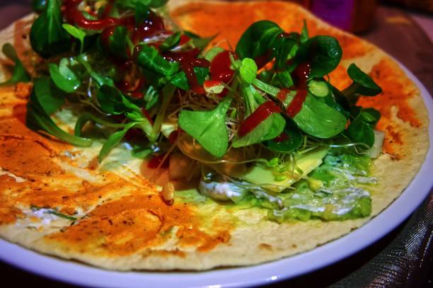 istock wrap closeup  covered with various vegetables and avocado creme 1093631716