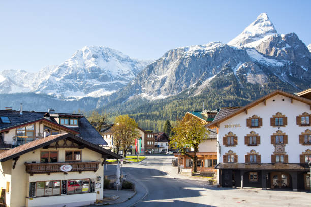 Village of Ehrwald in spring Ehrwald, Austria. May 2017. View of the village of Ehrwald in early spring, enclosed by mountains. ehrwald stock pictures, royalty-free photos & images