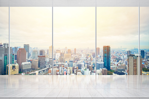 Business and design concept - empty marble ground and window with modern urban skyline aerial view in Osaka, Japan, for display or mock up