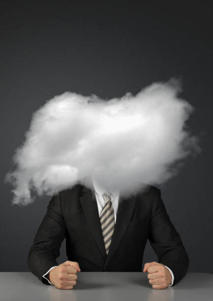 istock Angry faceless businessman with head in clouds 1093643994