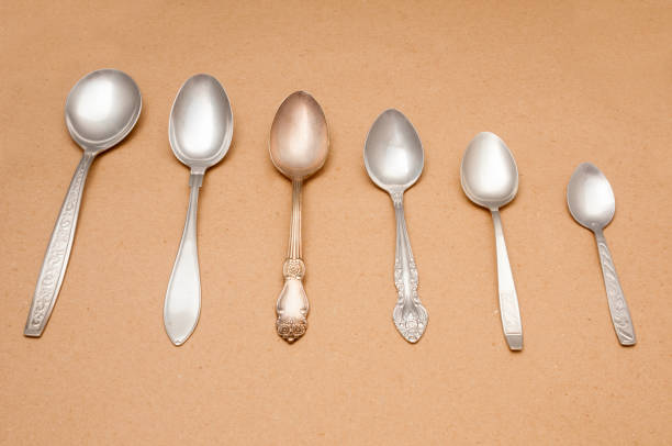 istock Vintage spoons close up on brown background 1093647840