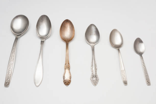 istock Old spoons close up on gray background 1093648018