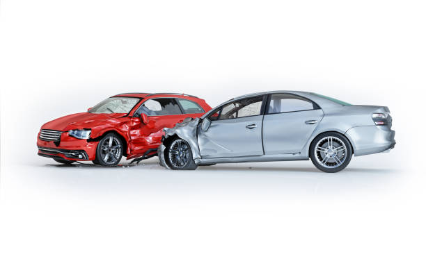 Two cars accident. Crashed cars. One silver sedan against one red coupé. Two cars accident. Crashed cars. One silver sedan against one red coupé. Big damage. Isolated on white background. Viewed from a side. 3d rendering. crash stock pictures, royalty-free photos & images