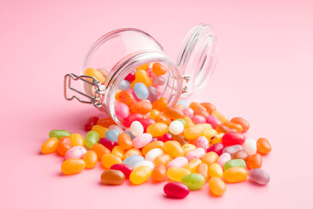 Sweet jelly beans Sweet jelly beans in jar. candy jellybean variation color image stock pictures, royalty-free photos & images