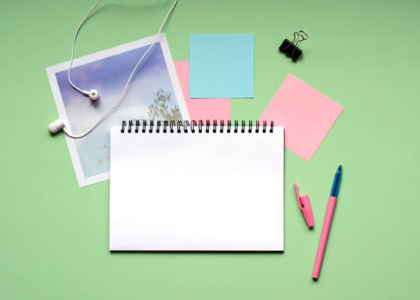 istock White pad on a spring on a green background. Office. 1093651980