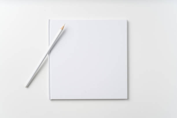 istock Top view of white notebook, page, pencil 1093652876