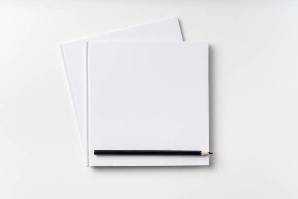 istock Top view of 2 white hardcover notebook, pencil 1093656036
