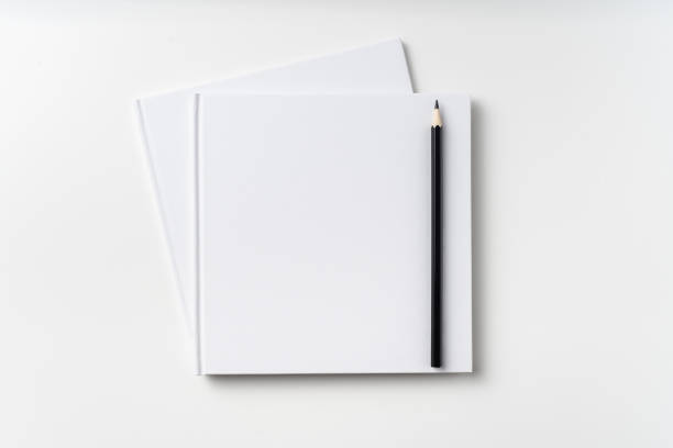 istock Top view of 2 white hardcover notebook, pencil 1093656058