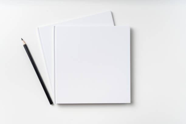 istock Top view of 2 white hardcover notebook, pencil 1093656088