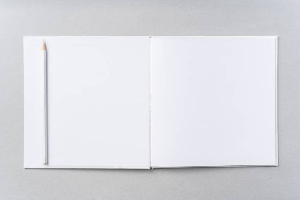 istock Top view of white hardcover notebook, pencil 1093656548