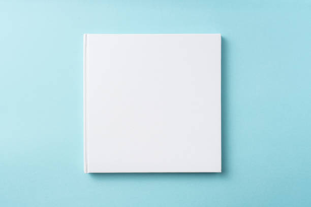 istock Top view of white hardcover notebook on blue 1093658566