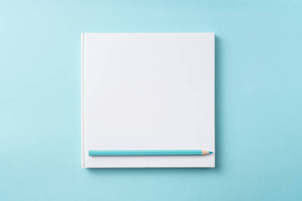 istock Top view of white hardcover notebook, pencil 1093658638