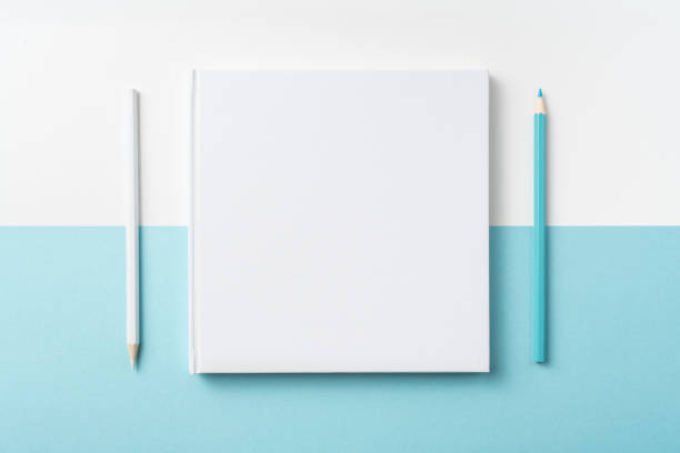 istock Top view of white hardcover notebook, pencil 1093658792