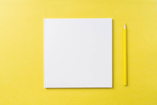 istock Top view of white hardcover notebook, pencil 1093658894