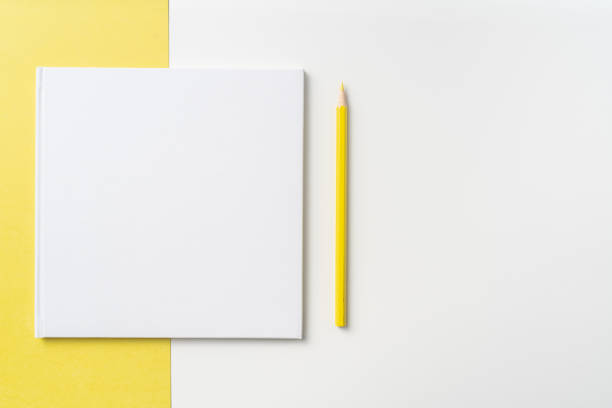 istock Top view of white hardcover notebook, pencil 1093658992