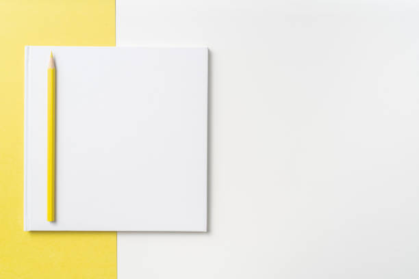 istock Top view of white hardcover notebook, pencil 1093659004