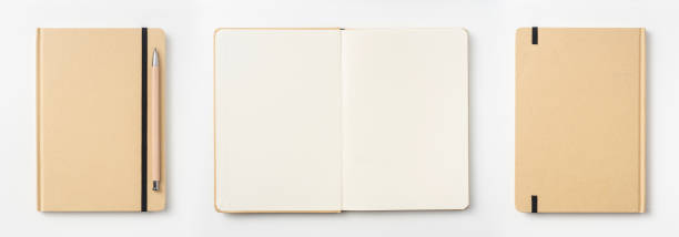istock Top view of kraft paper notebook, page, pencil 1093659384