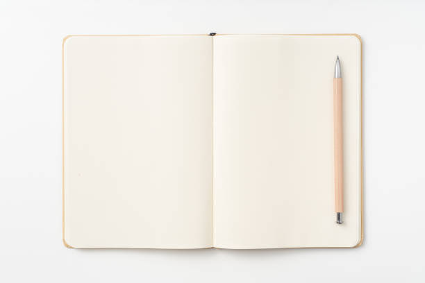 istock Top view of kraft paper notebook, page, pencil 1093659792
