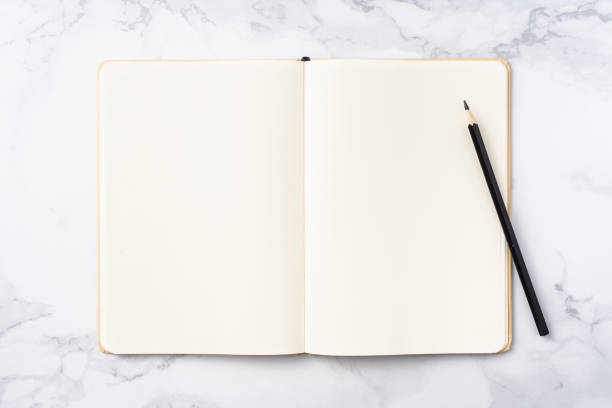 istock Top view of kraft paper notebook, page, pencil 1093661364