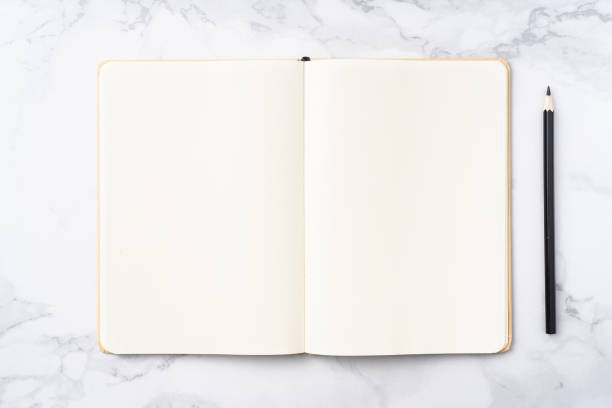 istock Top view of kraft paper notebook, page, pencil 1093661394