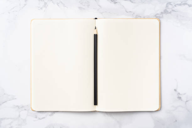 istock Top view of kraft paper notebook, page, pencil 1093661404