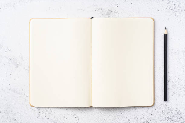 istock Top view of kraft paper notebook, page, pencil 1093661456