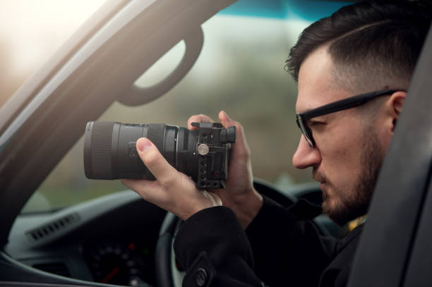 istock Close-up - Young Man Photorapher Sitting In The Car 1093672180