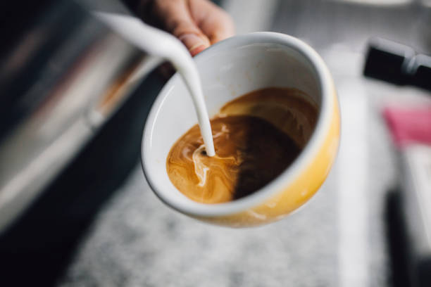 istock Barista holding coffee cup and make latte art coffee 1093672188