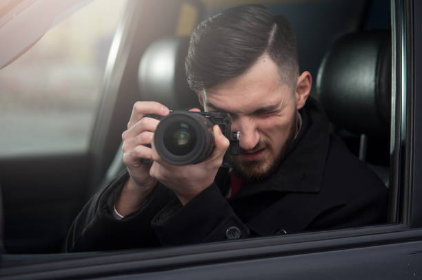 istock Close-up - Young Man Photorapher Sitting In The Car 1093672302