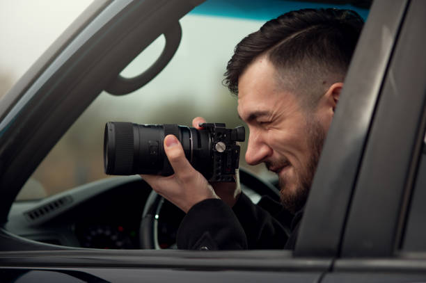 istock Close-up - Young Man Photorapher Sitting In The Car 1093672406