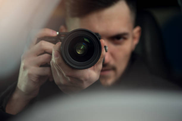 istock Spy Sits In Car And Taking Photos 1093672564