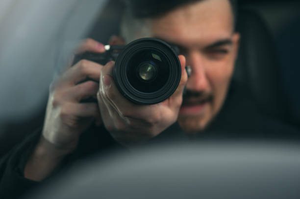 istock Spy Sits In Car And Taking Photos 1093672606