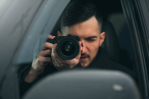 istock Spy Sits In Car And Taking Photos 1093672658