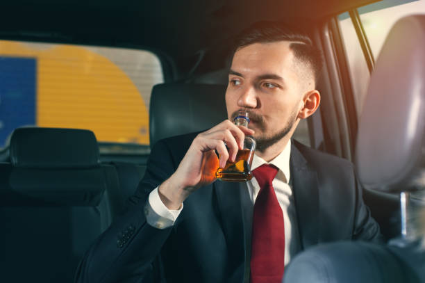 istock Young depressed businessman sitting in the car. 1093673340