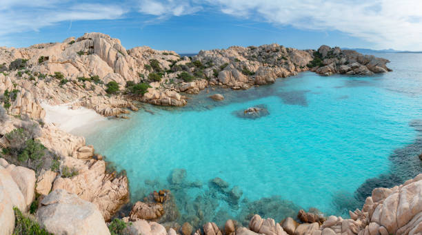 Cala Coticcio Beach, Caprera Island, Sardinia, Italy Huge Panorama of the famous secluded Cala Coticcio Beach Bay, Caprera Island, Sardinia, Italy. Nikon D850. Converted from RAW. sardinia stock pictures, royalty-free photos & images